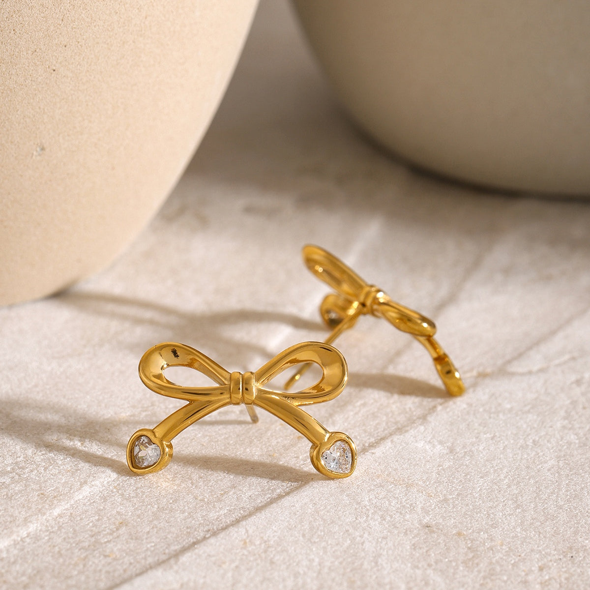 Stainless Steel Inlaid Zircon Bow Earrings 