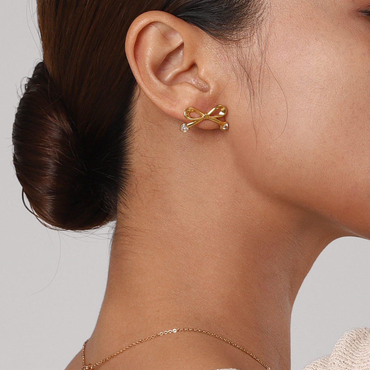 Stainless Steel Inlaid Zircon Bow Earrings 