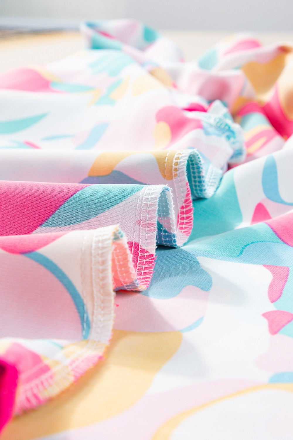 Plus Size Ruffled Printed Notched Cap Sleeve Blouse 