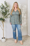 Heimish Full Size Floral Half Button Long Sleeve Blouse 