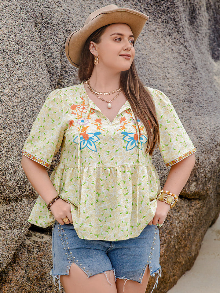 Plus Size Printed Tie Neck Half Sleeve Blouse 